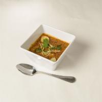 Dal Makhni · Whole black lentil simmered until tender and tempered with ginger, tomatoes, and herbs.