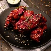 800° BBQ Wings · Seven wings tossed in our classic sweet BBQ sauce and sesame seeds. Served with your choice ...