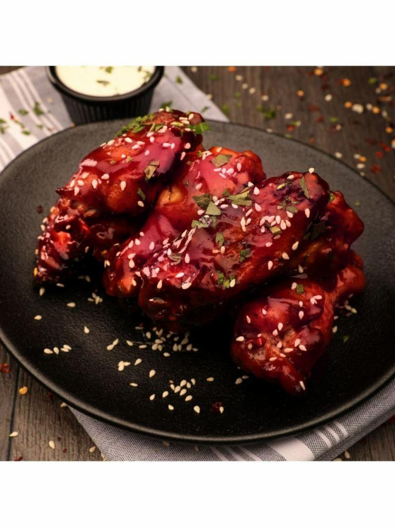 800° BBQ Wings · Seven wings tossed in our classic sweet BBQ sauce and sesame seeds. Served with your choice of blue cheese or ranch dressing.