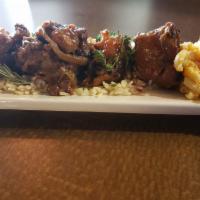 Oxtails  AVAILABLE SUNDAY ONLY · Tender, fall-off-the-bone oxtails over rice with gravy.  Oxtails come with two sides and sel...