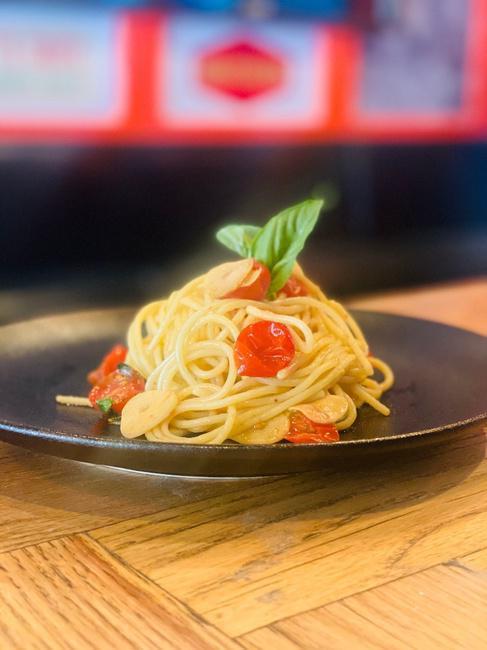 SPAGHETTI  CHECCA · fresh cherry tomatoes, garlic, olive oil & basil tossed with spaghetti