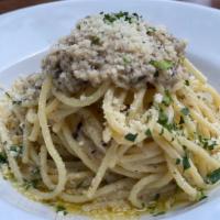 SPAGHETTI TRUFFLE ALFREDO · Decadent truffle in cheesy cream sauce over spaghetti