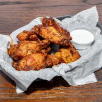 Smoked Wings · 9 pieces slow smoked wings in mango habanero, BBQ, or Buffalo sauce.