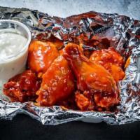 Chicken Wings · Choice of buffalo sauce or spicy dry rub.
