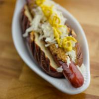 The Rottweiler · Brat with sauerkraut, stone ground mustard and topped with crushed seasoned pretzel and yell...