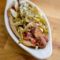 Bruno Valentino Dog · Italian sausage slathered in a sweet basil red sauce, topped with a sauteed medley of bell p...