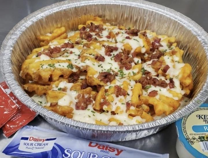 Loaded Fries · 3/4 lb. of seasoned fries, loaded with mozzarella and bacon. Includes a side of ketchup, ranch or sour cream.