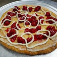Cherry Bomb Cheesecake · 11'' dessert pizza, sweet cream based, loaded with graham crackers, cherry filling and extra...