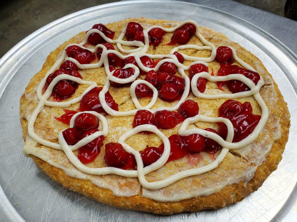 Cherry Bomb Cheesecake · 11'' dessert pizza, sweet cream based, loaded with graham crackers, cherry filling and extra cream cheese.