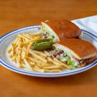 Torta · Mexican sandwich with your choice of meat, beans, mayonnaise, lettuce, onions, tomatoes, and...