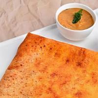 Podi Dosa · South Indian thin crepe made with fermented rice and lentil batter generously tossed with mi...