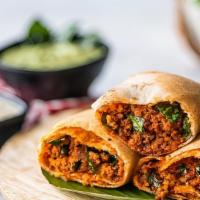 Lamb Kheema Dosa · South Indian thin crepe made with fermented rice and lentil batter stuffed with peppery minc...