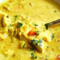Mulligatawny Soup · Yellow lentil soup with a touch of lemon and black pepper.