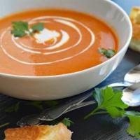 Tomato Soup · Homemade soup made with fresh tomatoes topped with crunchy croutons