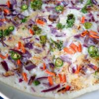 Carrot Peas Uthappam · Uthappam topped with carrot and peas
