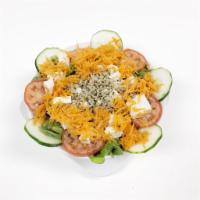Tofu Salad · Organic tofu, quinoa, mix greens, tomatoes, onions, cucumbers and carrots.