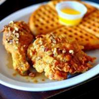 Chicken and Waffles · Homemade waffles with 2 pc fried chicken. Butter and syrup included 