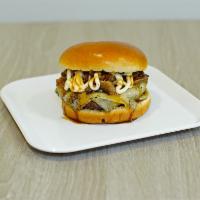 Truffle Burger · 5.3oz. Grass fed beef, Umai glaze, swiss cheese, caramelized onions, white truffle shiitake ...