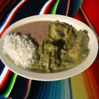 Costilla de Puerco con Nopales en Salsa Verde · Pork ribs with cactus on green sauce.served with rice,beans and 3 hand made tortillas on the...