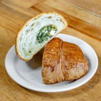 Spinach and Feta Croissant · A savory croissant filled with spinach and feta cheese.