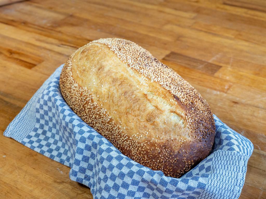 Golden Semolina Artisan Loaf · A classic, homestyle Italian bread with an airy texture. Versatile bread for a bread basket or for mopping a plate or soup bowl for the last delicious drops. Ingredients: Semolina (Durum) flour, Artisan Bread Flour, purified water, yeast, poolish, salt