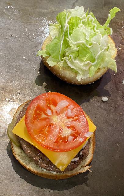 Angus Burger · Pickles, tomato, cheese, mayo, onions, lettuce.