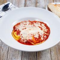 Cheese Ravioli · Filled with a blend of cheeses, topped with homemade marinara sauce and mozzarella cheese.