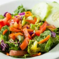House Garden Salad · Crispy lettuce topped with tomatoes & black olives. Served with your choice of Italian or ra...