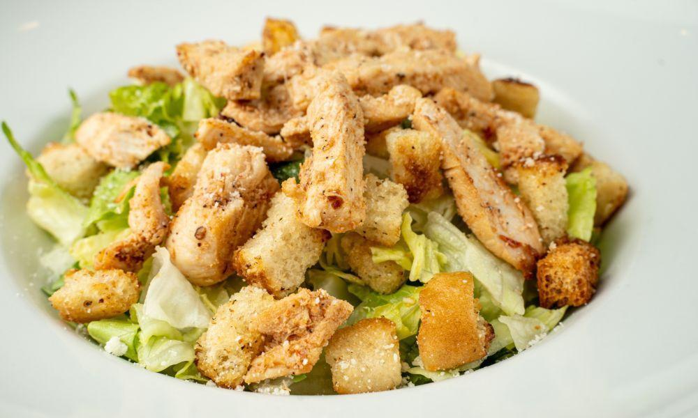 Chicken Caesar Salad · Our tasty caesar salad topped with succulent strips of chicken breast