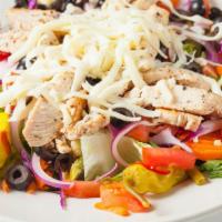 Italian Chicken Salad · Romaine lettuce topped with chicken breast, marinated vegetables, fresh tomatoes, onions, bl...