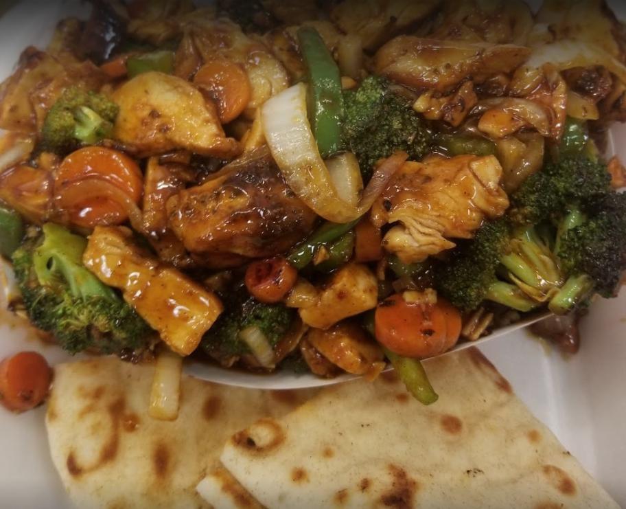 Chicken Stir Fry · Onions, green peppers, mushrooms, carrots, broccoli, and teriyaki sauce.