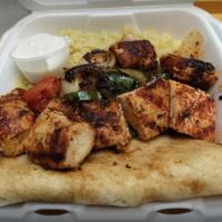 Chicken Kebob · 1 skewer served with grilled onions, green peppers and rice.