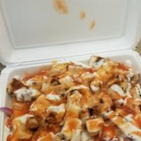 New York Rice · Rice, chicken, onions, tomatoes, spicy sauce and ranch dressing. Please make sure to be spec...