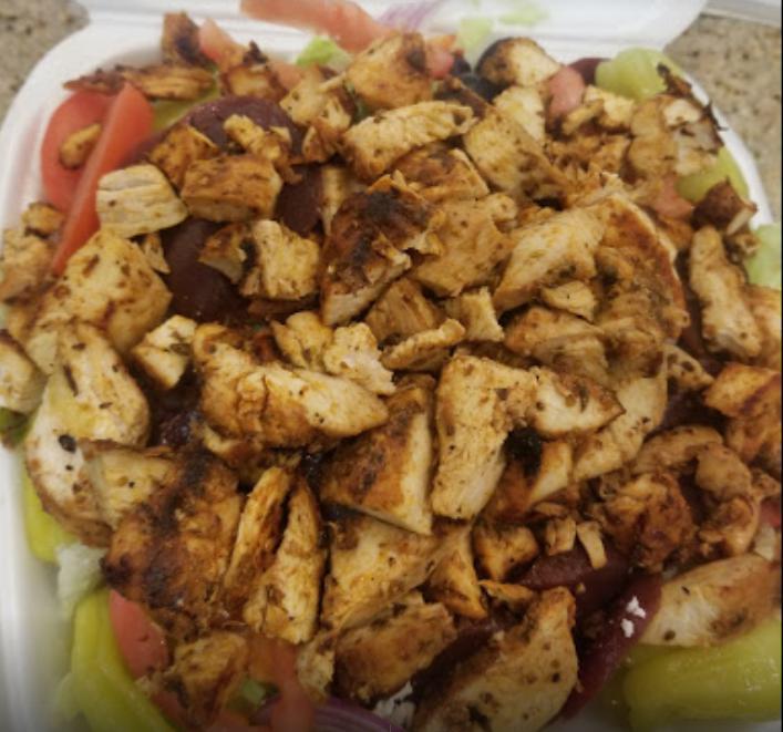 Greek Chicken Salad · Lettuce, tomato, cucumbers slices, pepperoncini, Greek olives, beets, feta cheese, chicken breast, and Greek dressing. 