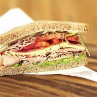 Baja Chipotle Turkey Sandwich · Smoked turkey breast, chipotle honey-lime yogurt sauce, shaved cabbage, pickled red onion, t...