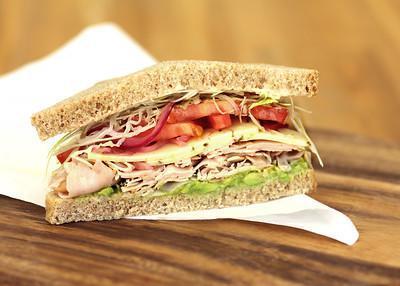 Baja Chipotle Turkey Sandwich · Smoked turkey breast, chipotle honey-lime yogurt sauce, shaved cabbage, pickled red onion, tomato, avocado, pepper jack cheese, salt and pepper.