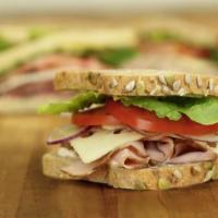 Classic Turkey and Cheese Sandwich · Boar's Head smoked turkey with cheese, lettuce, tomato, red onion, Dijon mustard, mayo, salt...