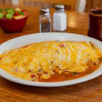 Breakfast Burrito · Scrambled eggs, hashbrowns, wrapped in a tortilla smothered with housemade green chili and c...