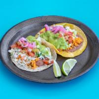 Veggie Taco · Folded tortilla with vegetables.