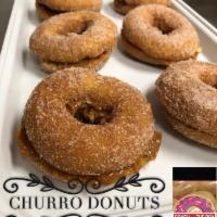 Churro Donut · Churro donut our plain cake tumbled in a sugar and cinnamon mix and filled with dulce de lec...