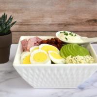 Cobb Salad · Smoked Ham, Crispy Bacon, Egg, Blue Cheese Crumble, Avocado over Butter Lettuce and side of ...