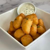 Fried Cheese Curds  · 1/2 lb of Wisconsin white cheddar cheese curds, served with buttermilk ranch