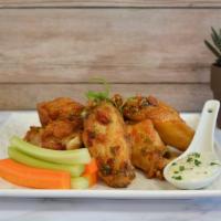 Sweet Thai Chili Wings · Sweet thai glaze with fresh fresno peppers and chopped green onion.