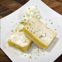 Lemon Bars · Luscious Lemon Curd in a Buttery Shortbread with Fresh Lime Zest. 