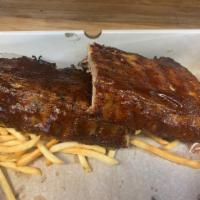 Full Rack · Full rack of in-house apple wood smoked Baby Back Ribs with your choice of sauce, a packet o...