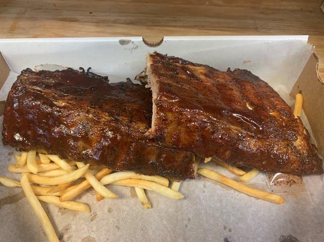 Full Rack · Full rack of in-house apple wood smoked Baby Back Ribs with your choice of sauce, a packet of our Duck Rub and served over a bed of French fries