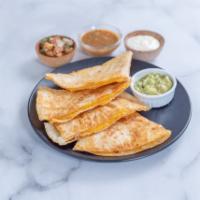 Quesadillas · Fresh flour tortilla filled with cheese, topped with homemade guacamole, sour cream and salsa.