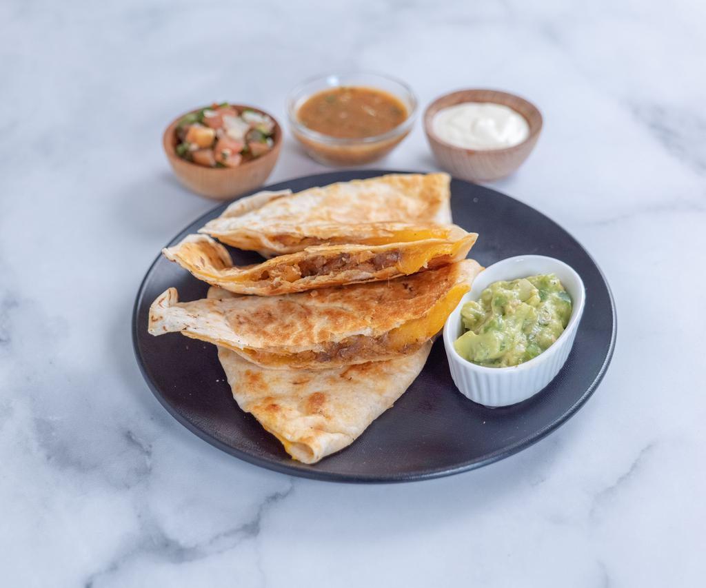 Meat Quesadilla · Steak, carnitas or chicken with fresh flour tortilla filled with cheese, topped with homemade guacamole, sour cream and salsa.