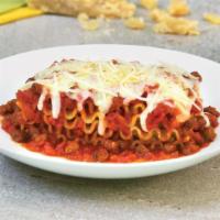 Lasagna with Meat Sauce · Layered dish with wide flat pasta.