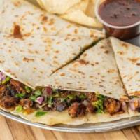 Grande Quesadilla · Chicken, ground beef, or steak on a soft flour tortilla, grilled to crispy perfection and se...